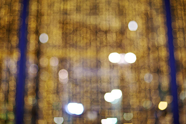 Golden glittering christmas lights. Blurred abstract background. Bokeh stock photo