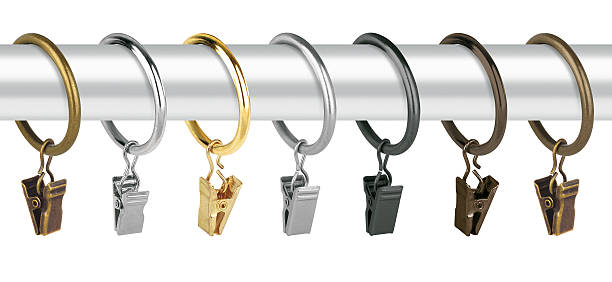Metal rings with clips for curtain cornices