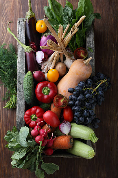 Fresh vegetables in wood crate stock photo