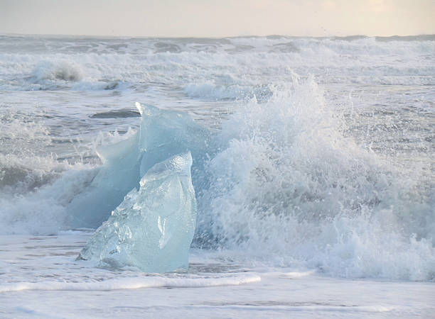 istock Wave hitting icebergs on the beach of South Iceland 628250224