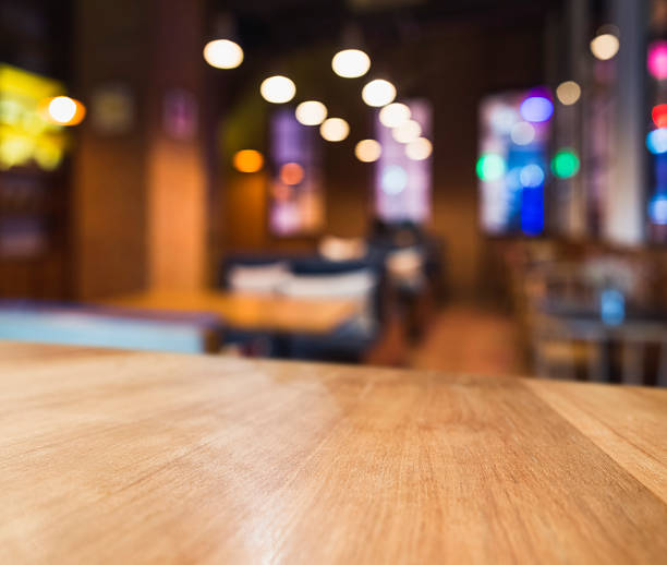 istock Table top Colourful light Blurred Bar Seats Restaurant Cafe Interior 628263512