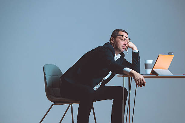 Boring work Funny businessman sleeping in the office boredom stock pictures, royalty-free photos & images
