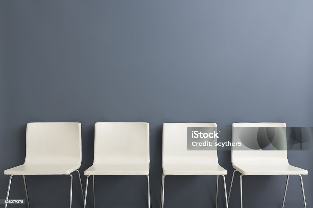 Chair background concept - recruitment hire hiring interview resources job employment career jobless recruitment interview business applicant hiring talent design hire chair white minimalism sitting blank space headhunting concept - stock image Waiting Room Stock Photo