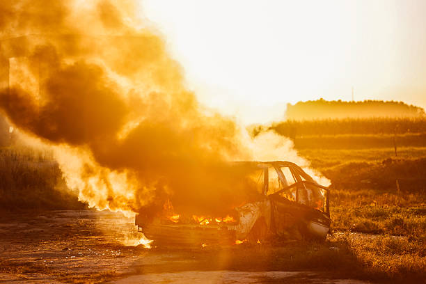 istock Burning car with open flames and smoke 628280026