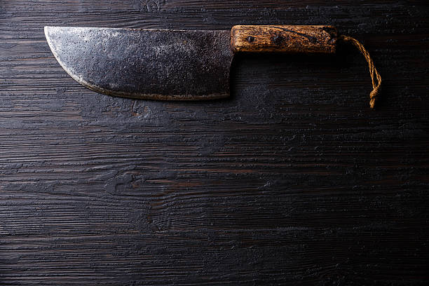 istock Butcher meat cleaver on wooden background 628286250