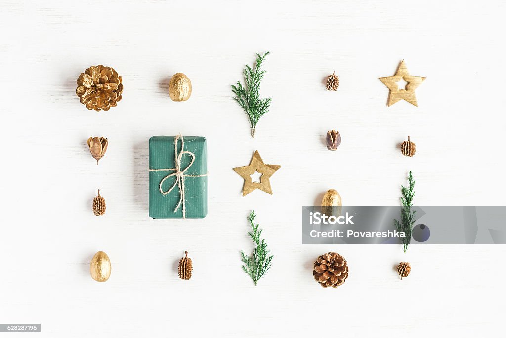 Gift, christmas decoration, cypress branches, pine cones. Flat lay Christmas composition. Gift, christmas decoration, cypress branches, pine cones. Flat lay, top view Christmas Stock Photo