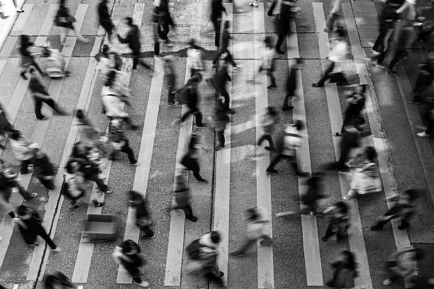 Busy pedestrian crossing at Hong Kong (Black And White) Busy pedestrian crossing at Hong Kong (Black And White) crossing sign stock pictures, royalty-free photos & images