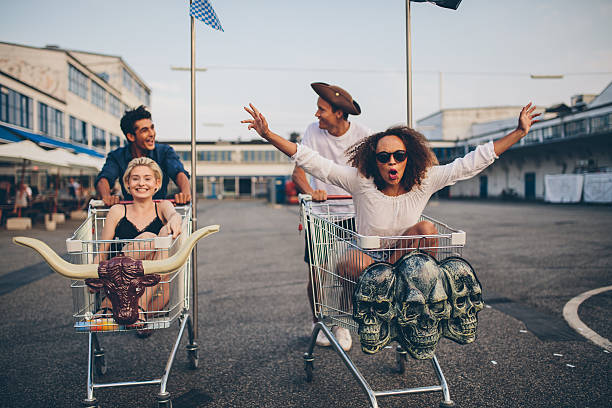 istock Young friends racing with shopping carts 628295534