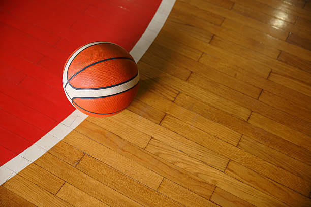 istock Basketball ball on court floor 628296558