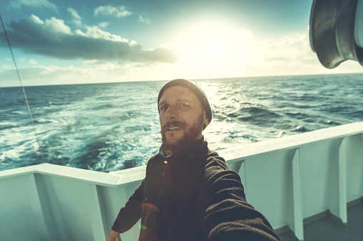 Fishermen at work: selfie from the trawler with sailing