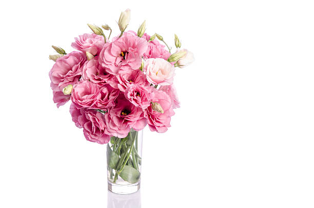 istock bunch of pink eustoma flowers in glass vase 628297704