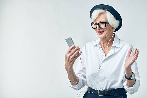 istock Senior music lover with smartphone 628304724