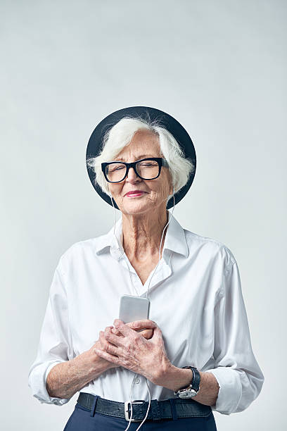 istock Senior woman enjoying music 628304826