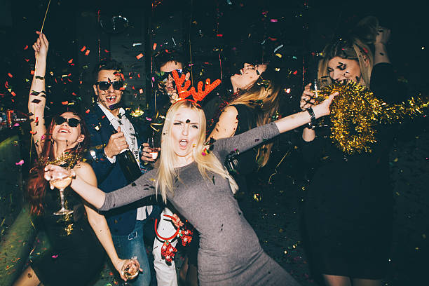 Group of friends having fun in the club Group of friends having fun for new year's eve in a club. Drinking and dancing together renegade dance stock pictures, royalty-free photos & images
