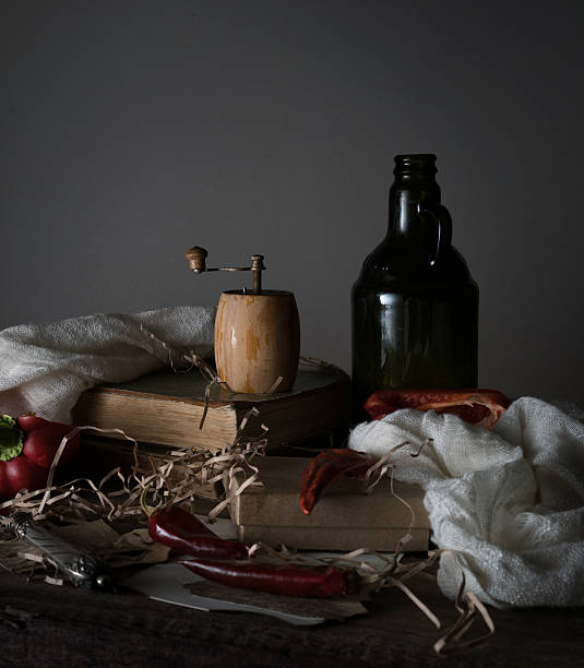 istock still life, vintage. old bottle with oil, red pepper, mill 628308898