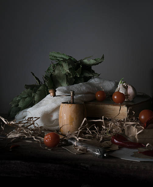 istock still life, vintage. cherry tomatoes, laurel, a mill and an 628309072