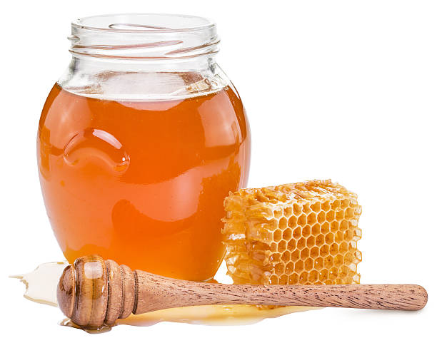 istock Jar full of fresh honey and honeycombs. 628310372