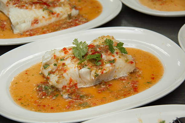istock Steamed snow fish with spicy sauce 628310460