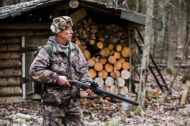 istock Male hunter in the forest 628318288
