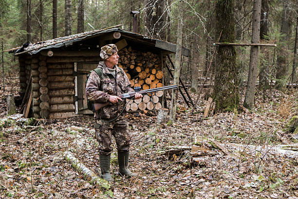 istock Male hunter in the forest 628318408