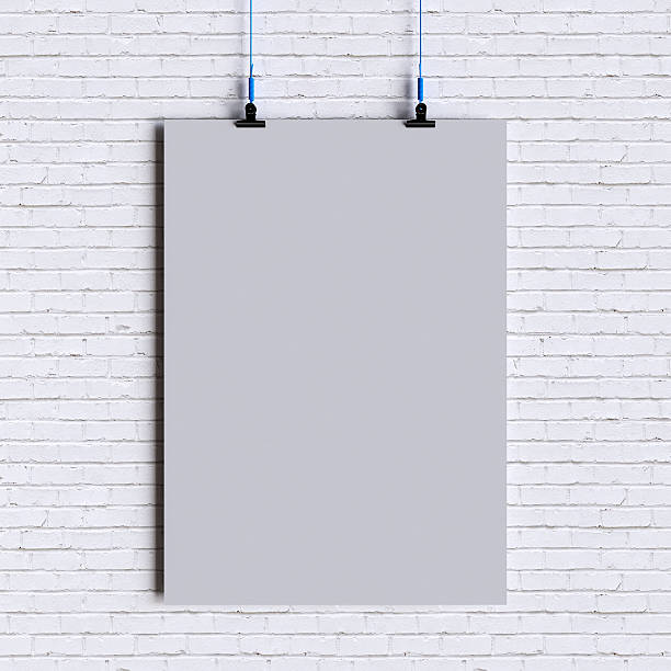 istock Paper blank poster template hanging over wall. 3D illustration 628318836