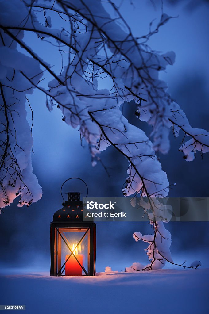 Candle lantern in the snow Lantern Stock Photo