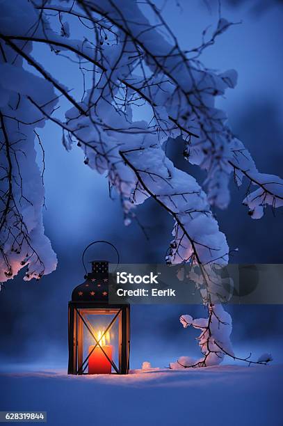 Candle Lantern In The Snow Stock Photo - Download Image Now - Lantern, Winter, Snow