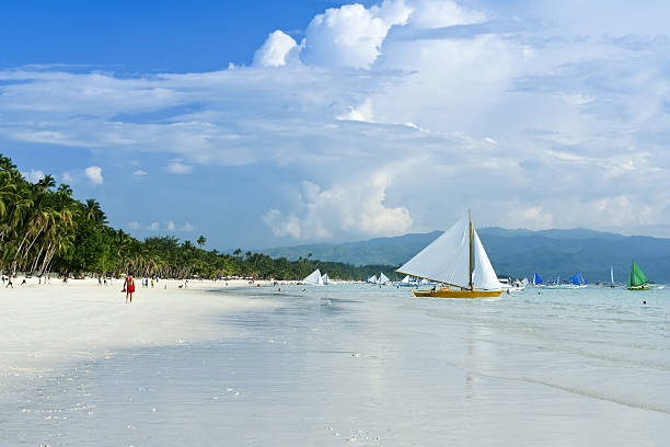 paraw outrigger sailboats on boracay white beach popular tourist destination in the philippines