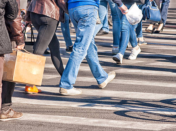 istock pedestrians walking on a pedestrian crossing 628326066