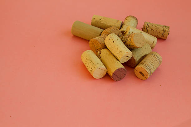 istock Heap of different corks on pink background 628326168