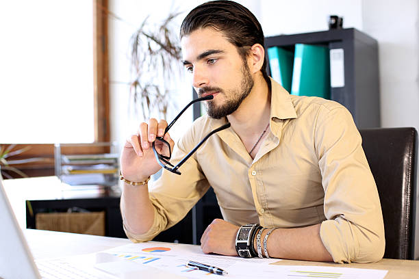 istock Business man looks concentrated 628326662