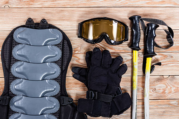 istock Overhead view of ski and snowboard accessories placed on rustic 628326720