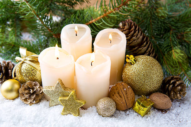 istock Four burning advent candles and Christmas decoration. 628328984