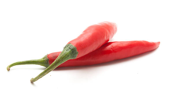 istock Red hot chili peppers isolated 628329082