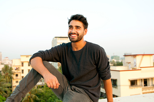 Side view portrait of a beautifull smiling man indian ethnicity