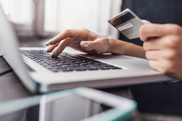 Woman is shopping online with laptop