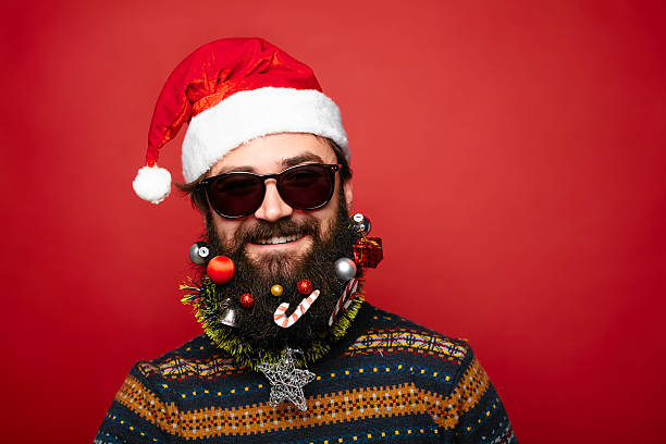 istock Christmas man in Santa hat and sunglasses 628333912
