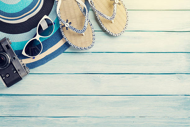 istock Beach accessories. Flip flops, camera, hat and sunglasses 628334466