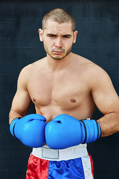Boxer shorts and gloves practicing on the street