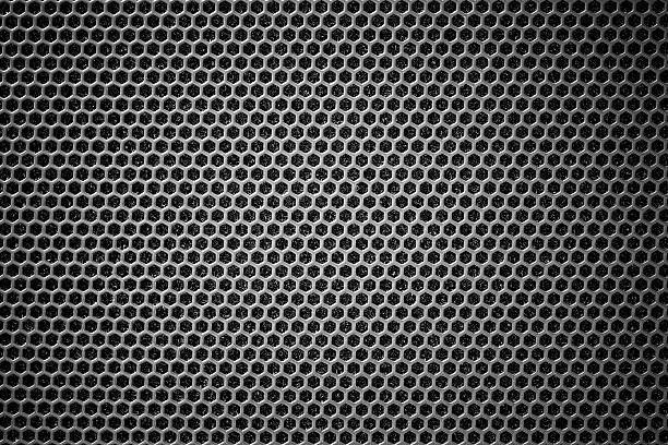 istock Steel grating black background With hexagonal holes 628335630