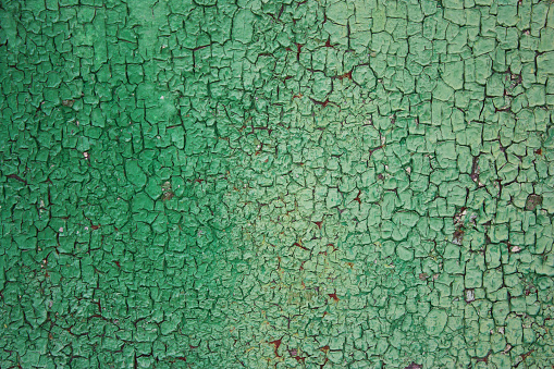 Green rusty background, rough, rough texture in the cracks. Corrosion of metal iron. The Army, the city banner, billboard