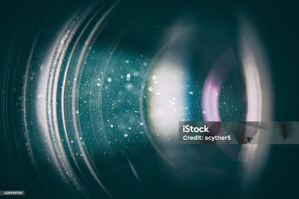 Camera lens with lense reflections. flare lens camera background macro light flash real bright film focus performance dust black optical color glowing concept - stock image Camera - Photographic Equipment Stock Photo