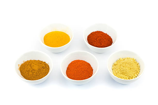 istock Porcelain bowls with several seasoning spices on white backgroun 628350320