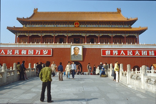 Beijing, China, May 16, 1987.Chinese tourists in the Forbidden City in Beijing. In the Background the Portrait of Mao above the Gate of the Imperial Palace.