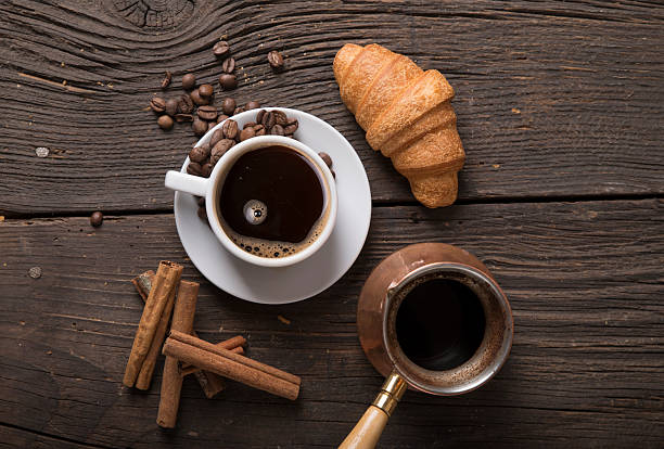 istock Cup of coffee with brown sugar on a wooden table 628355768