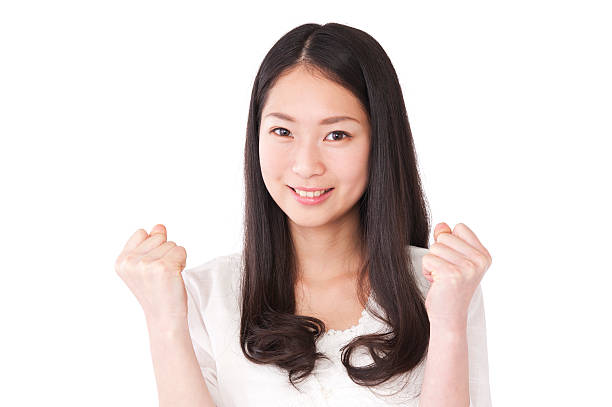 istock Asian young woman with arms raised 628356422