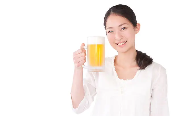 Asian young woman holding beer grass