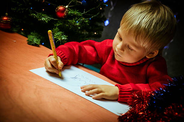 istock Boy writing letter to Santa 628359292