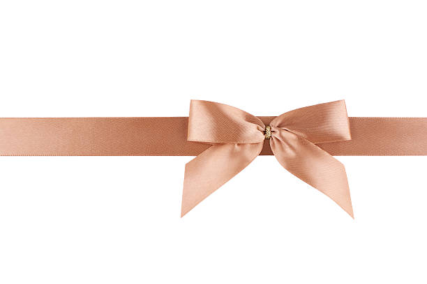 istock Beige ribbon with bow isolated on white background 628360746