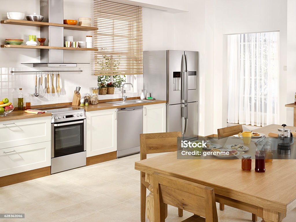 Modern kitchen complete view of a modern empty kitchen with breakfast table Kitchen Stock Photo